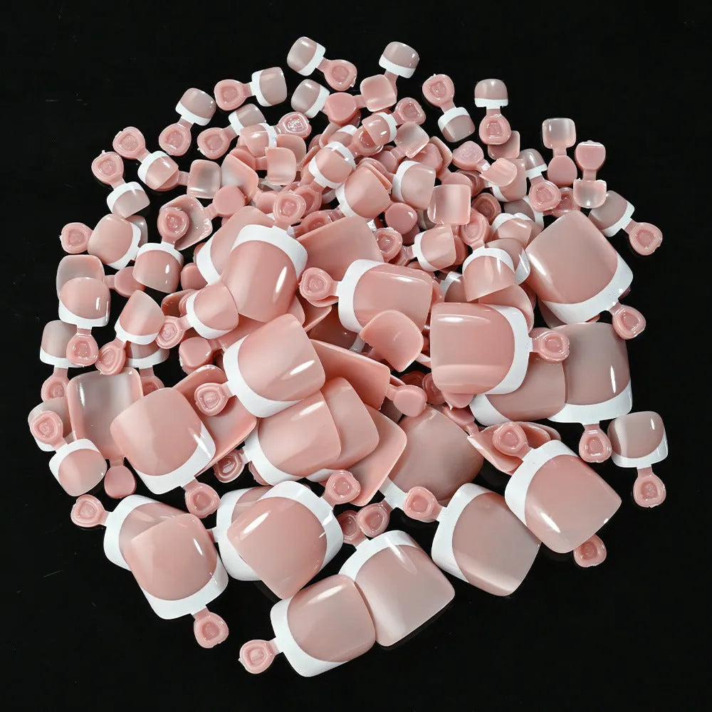 120 piece box of French white edge full square short nude artificial nail tips in nine shades.