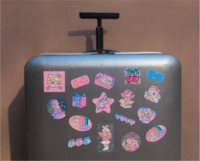 Pack of 16 cute cartoon girl and heart PVC stickers in a square storage box for DIY decoration.