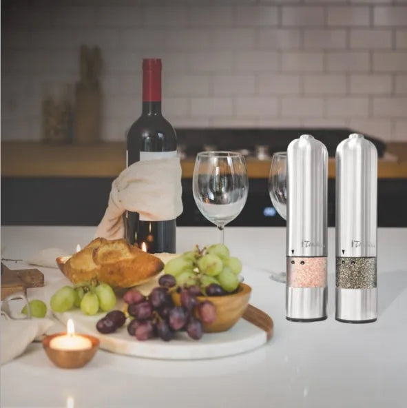 Stainless steel electric pepper grinder mill in natural colour, shown upright.