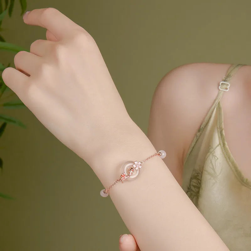 S925 sterling silver bracelet with white chalcedony crystal flower and koi charm