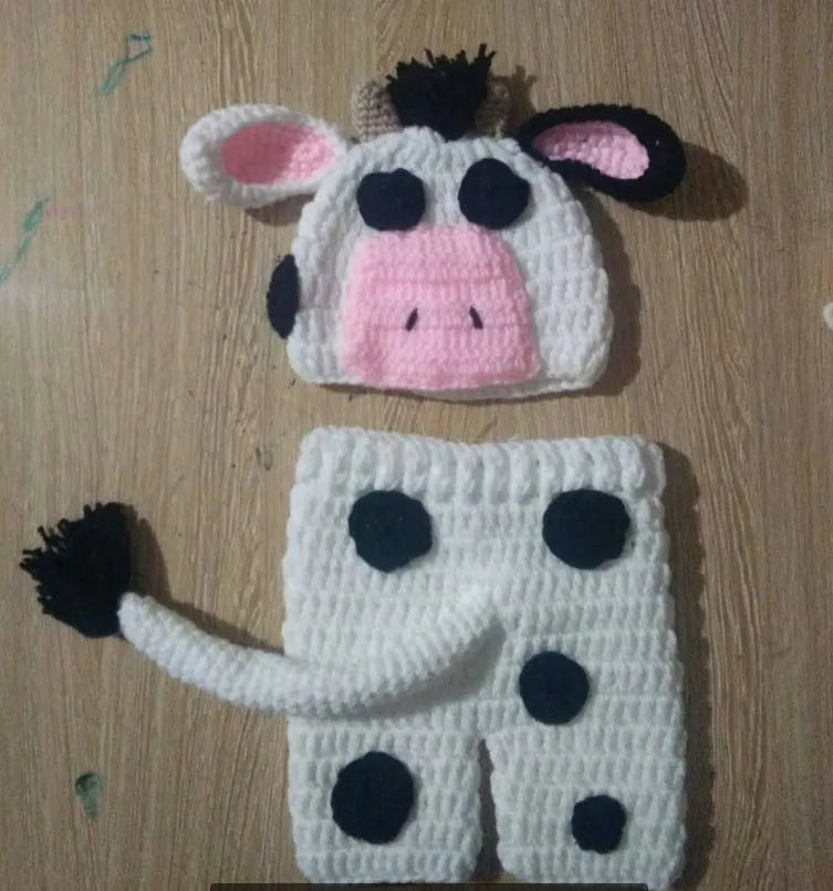 Hand-knitted white baby cow suit set with matching hat and pants for newborn infants