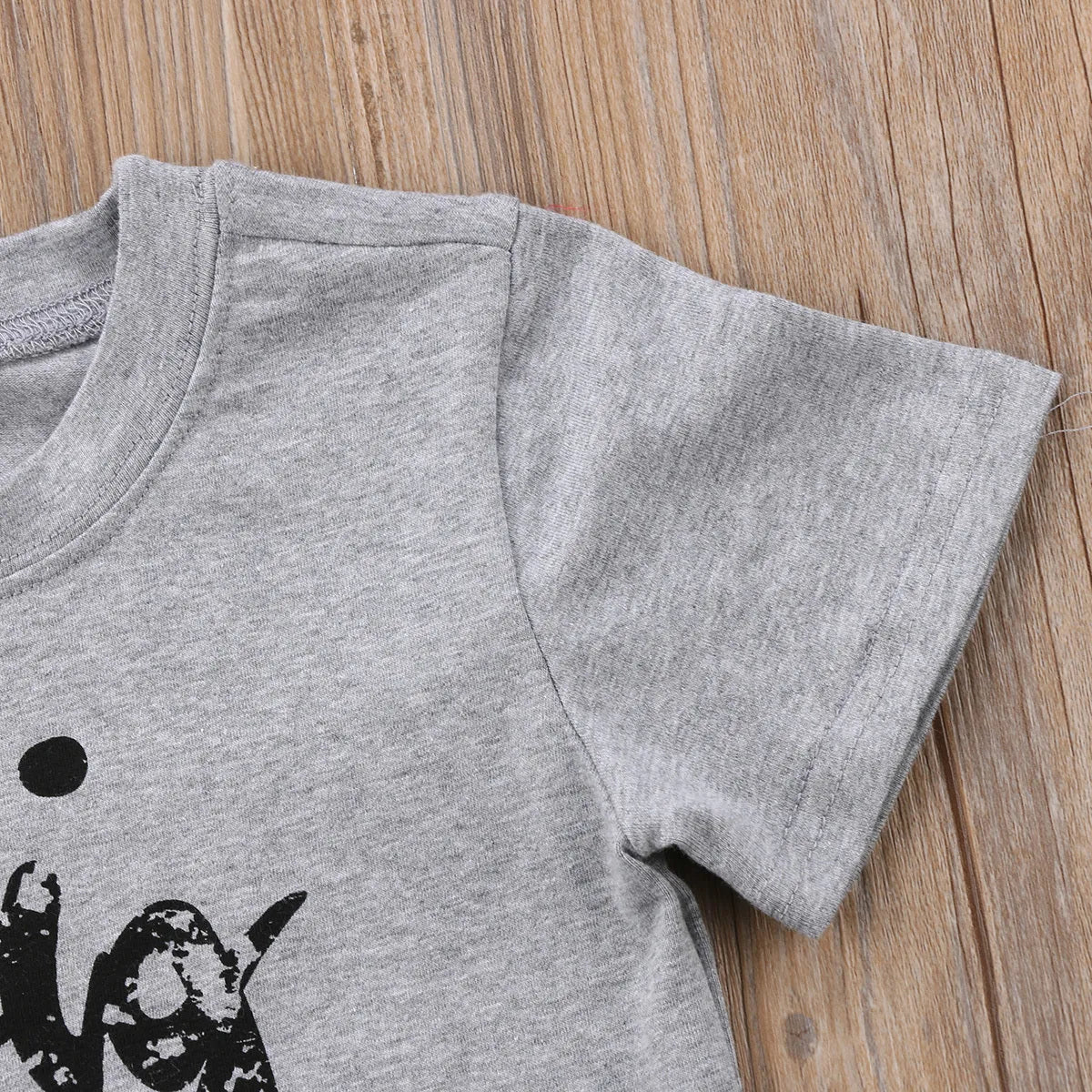 Grey cotton printed t-shirt showing size options from 60cm to 140cm on a size chart