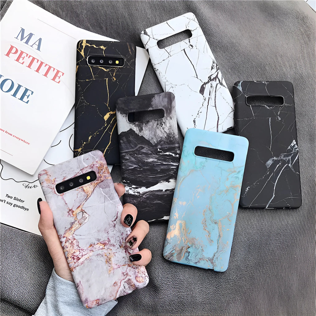 Samsung Galaxy phone in a hard PC back cover case with a white and grey marble pattern design.