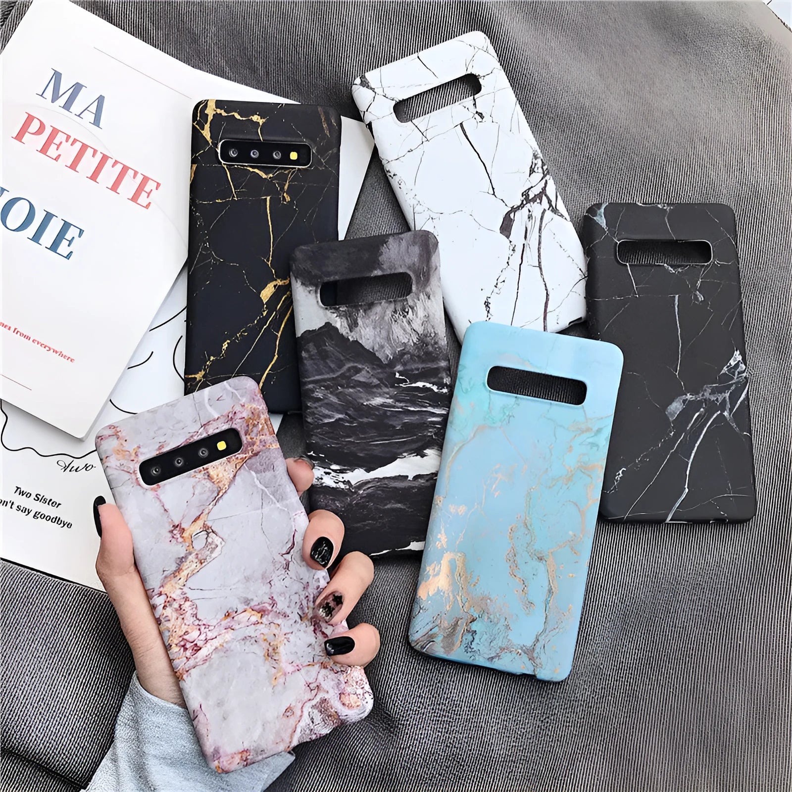Samsung Galaxy phone in a hard PC back cover case with a white and grey marble pattern design.