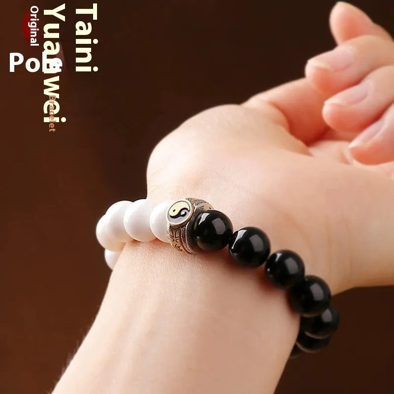 Black and white obsidian bracelet with taiji symbol and mantra bead