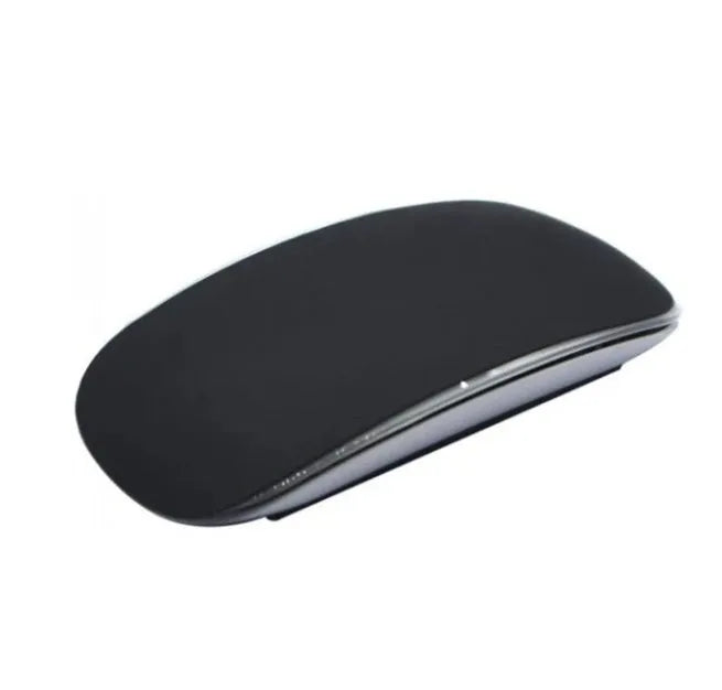 Silicone Magic Mouse cover skin in black on a white desk next to an Apple Magic Mouse