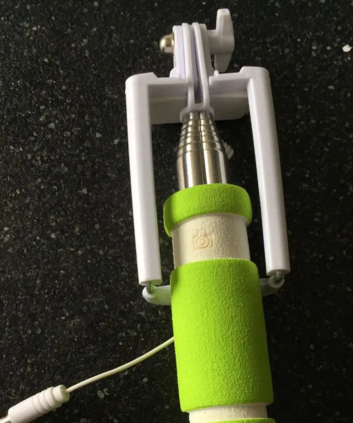 Folding selfie stick for cell phones shown in black, blue, green, orange, and pink