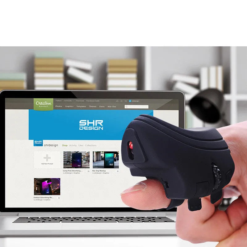 Rechargeable Bluetooth 2.4G wireless ring mouse on a finger, black colour, compact size 60x40mm