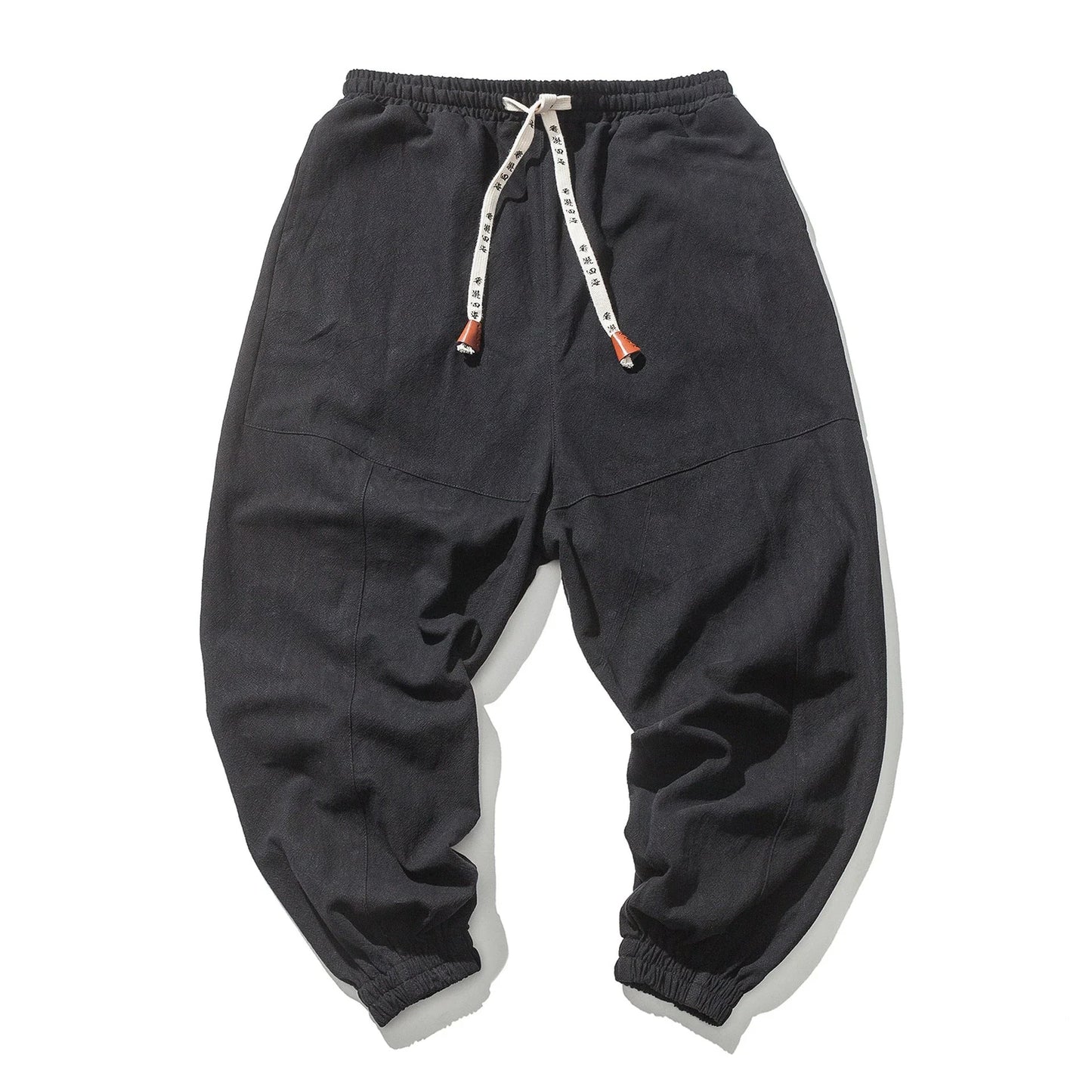 Men's cotton jogger pants with drawstring waist, side pockets, and tapered legs in various colors