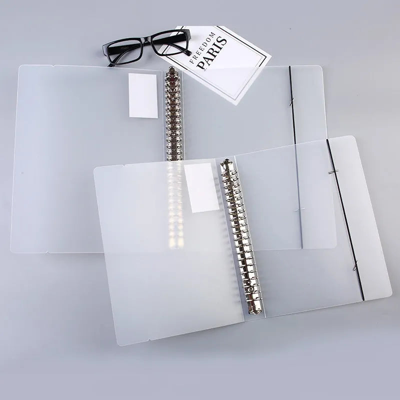 A5 loose-leaf notebook with 26-hole binder system showing horizontal line ruling on paper