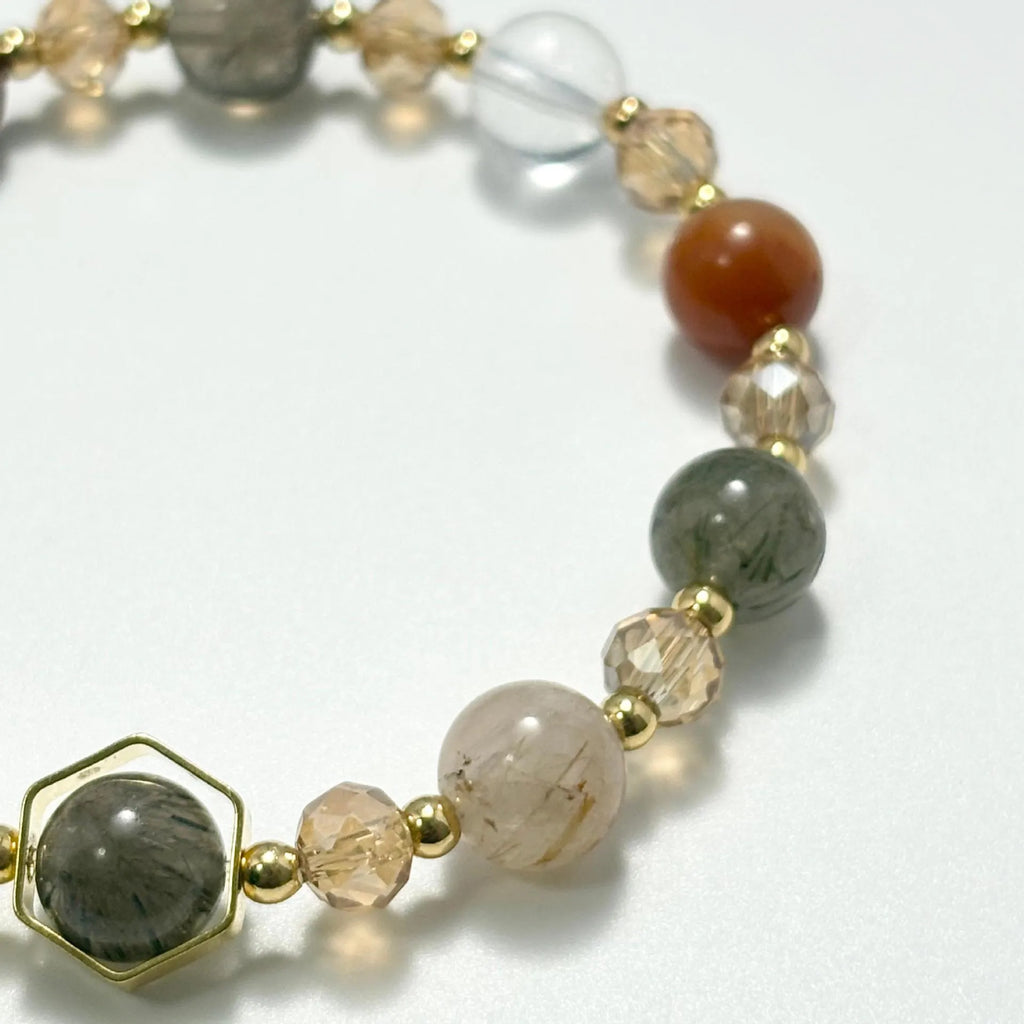 Gold-coloured citrine bracelet with hand-woven construction showing auspicious Chinese symbols