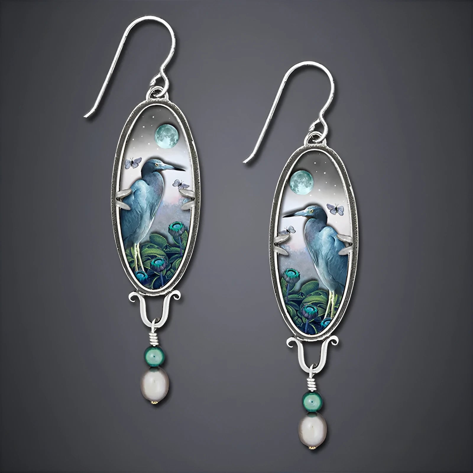 Silver-coloured drop shape earrings with a retro bird and flower electroplated design.