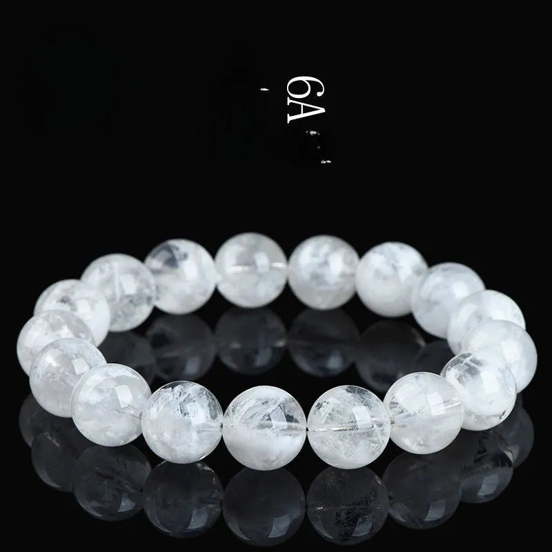Crystal women's bracelet with natural blizzard snowflake round beads in geometric shapes showing traditional Ruyi and Xiangyun motifs