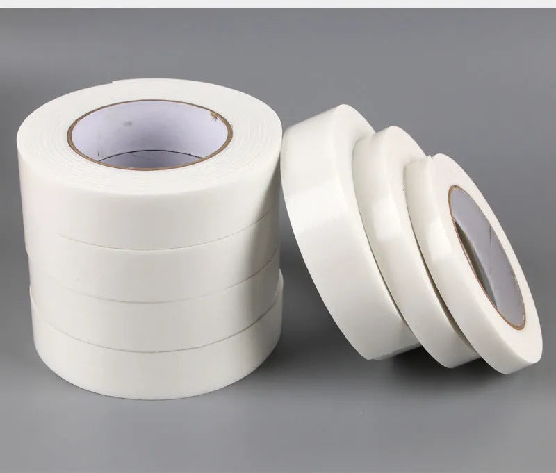 Roll of 3mm thick foam double-sided adhesive tape showing sponge core, with size options 15mm, 18mm, and 30mm wide.