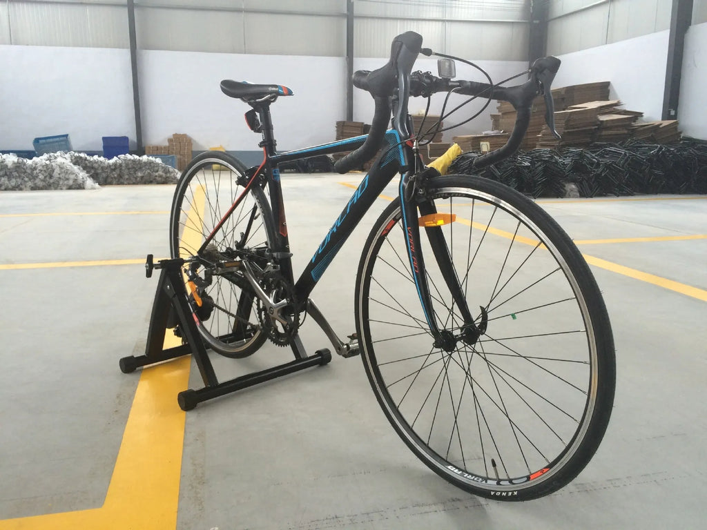 Black magnetoresistance indoor cycling training table with parking frame for 66-69CM wheel bikes