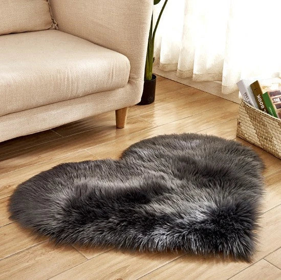 Soft and plush heart-shaped rug in various colors, perfect for cozy home decor