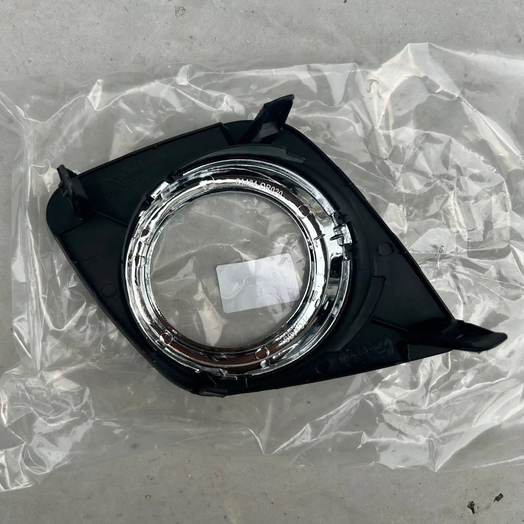 Black anti-fog lamp cover accessory for Toyota RAV4 front bumper, suitable for driver or passenger side.