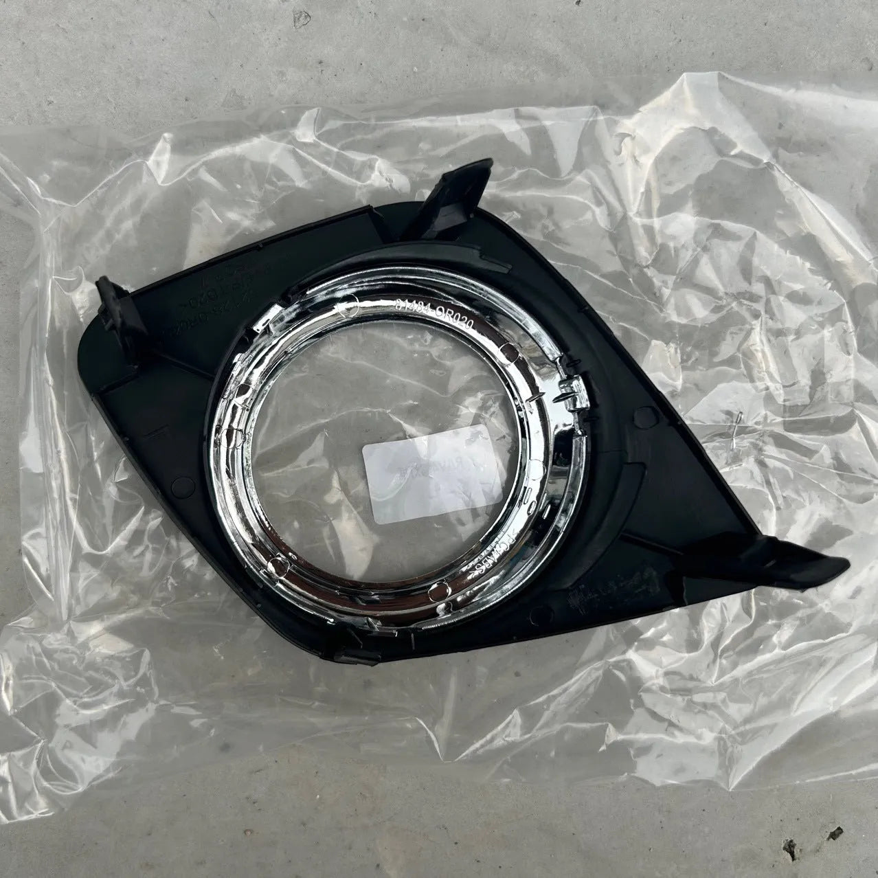 Black anti-fog lamp cover accessory for Toyota RAV4 front bumper, suitable for driver or passenger side.