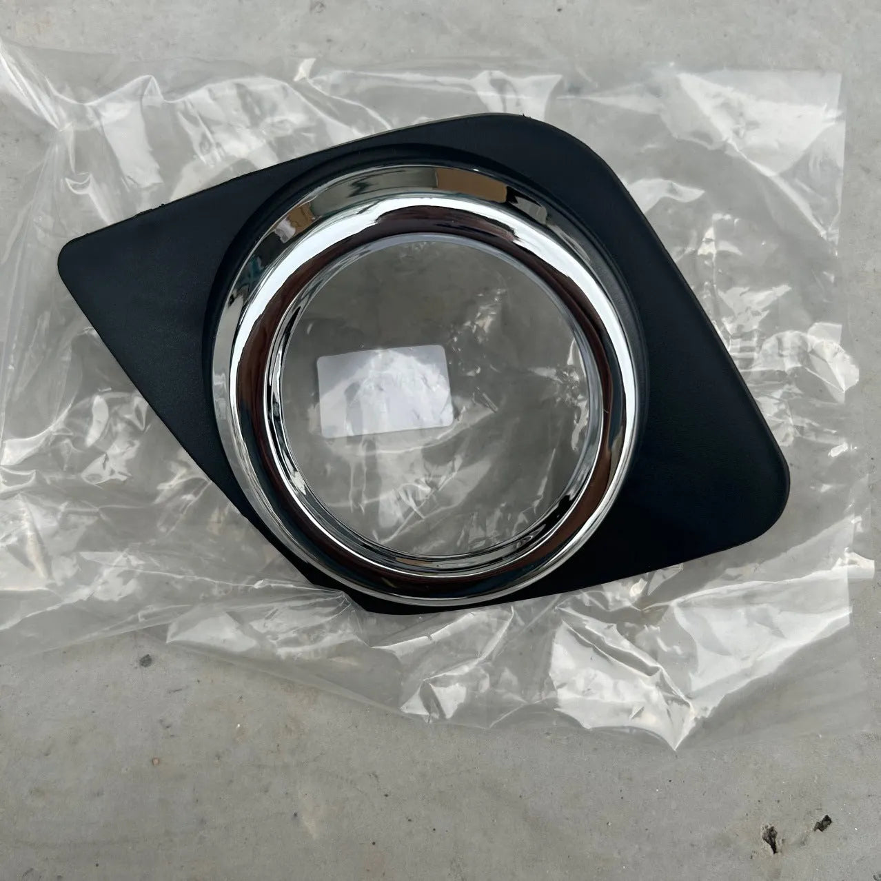 Black anti-fog lamp cover accessory for Toyota RAV4 front bumper, suitable for driver or passenger side.