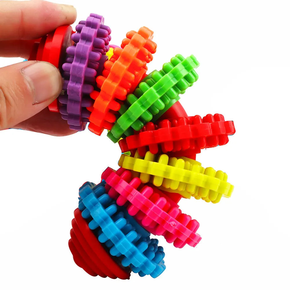 Colorful swivel TPR plastic seven-ring pagoda dog molar toy for teeth cleaning and play