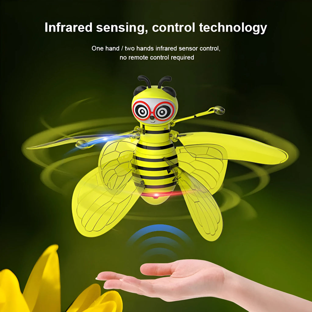Yellow mini flying ball bee drone with infrared gesture sensing, ABS plastic body, and removable wings on a white background