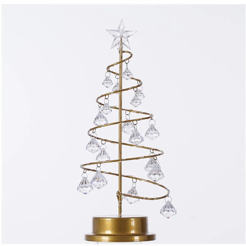 Gold crystal Christmas tree LED light with battery-powered warm glow on a shelf