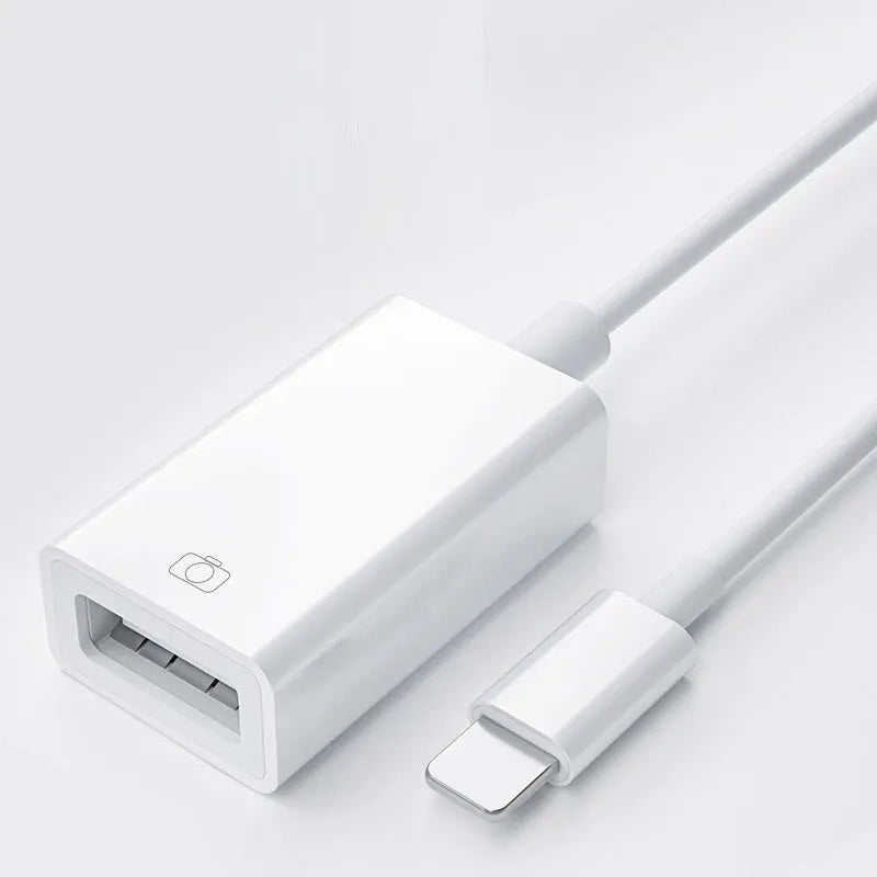 Apple OTG adapter cable in white plastic with Lightning connector and USB port