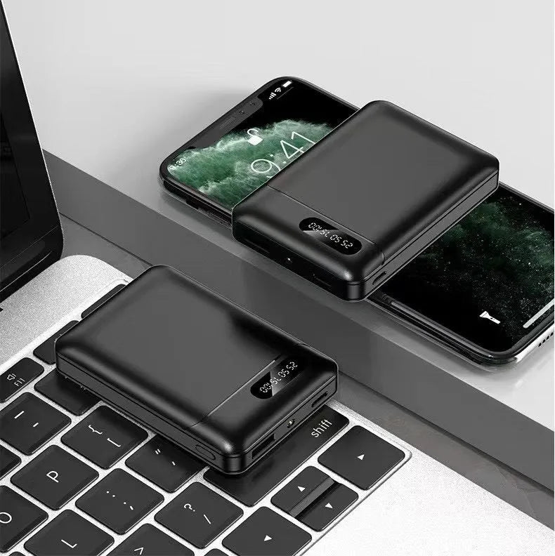 White or black plastic portable power bank with USB ports showing dimensions 92mm x 63mm x 23mm