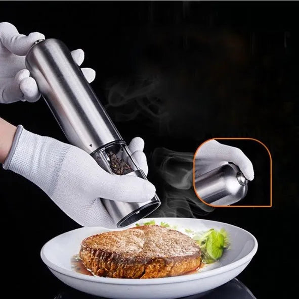 Stainless steel electric pepper grinder mill in natural colour, shown upright.