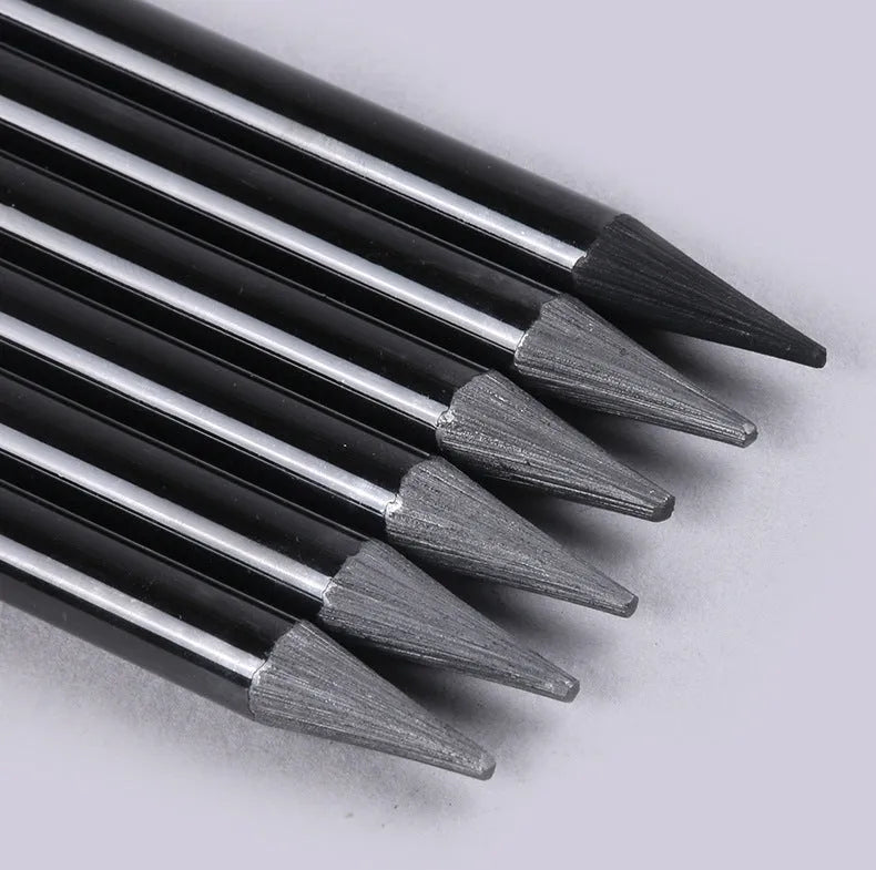 Carbonized pencil set showing six graphite and three carbonized drawing pencils with wooden casings on suction card packaging