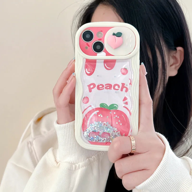 Fruit style quicksand phone case in quicksand peach, all-inclusive TPU design for iPhone, fall protection, cartoon elements.