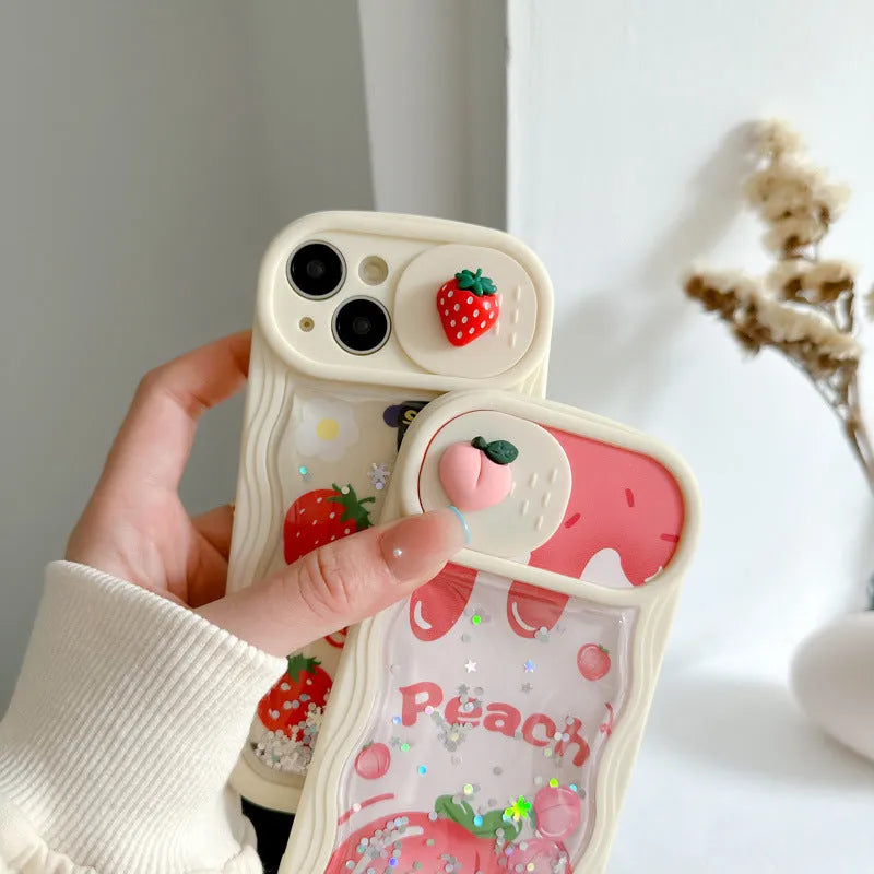 Fruit style quicksand phone case in quicksand peach, all-inclusive TPU design for iPhone, fall protection, cartoon elements.