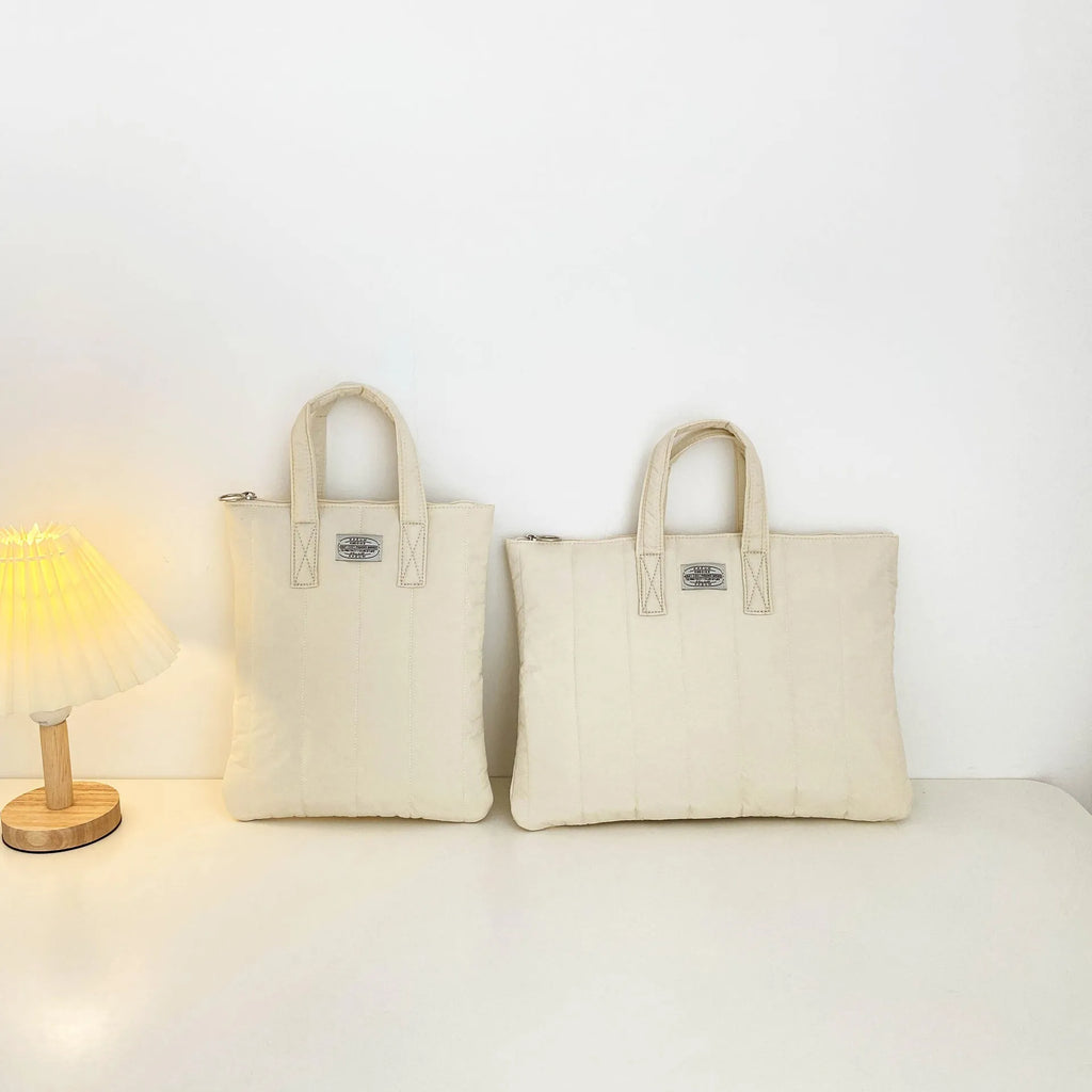 Personalised polyester laptop briefcase in milky white, shown with size options for 11, 13-14, and 15-15.6 inch devices.