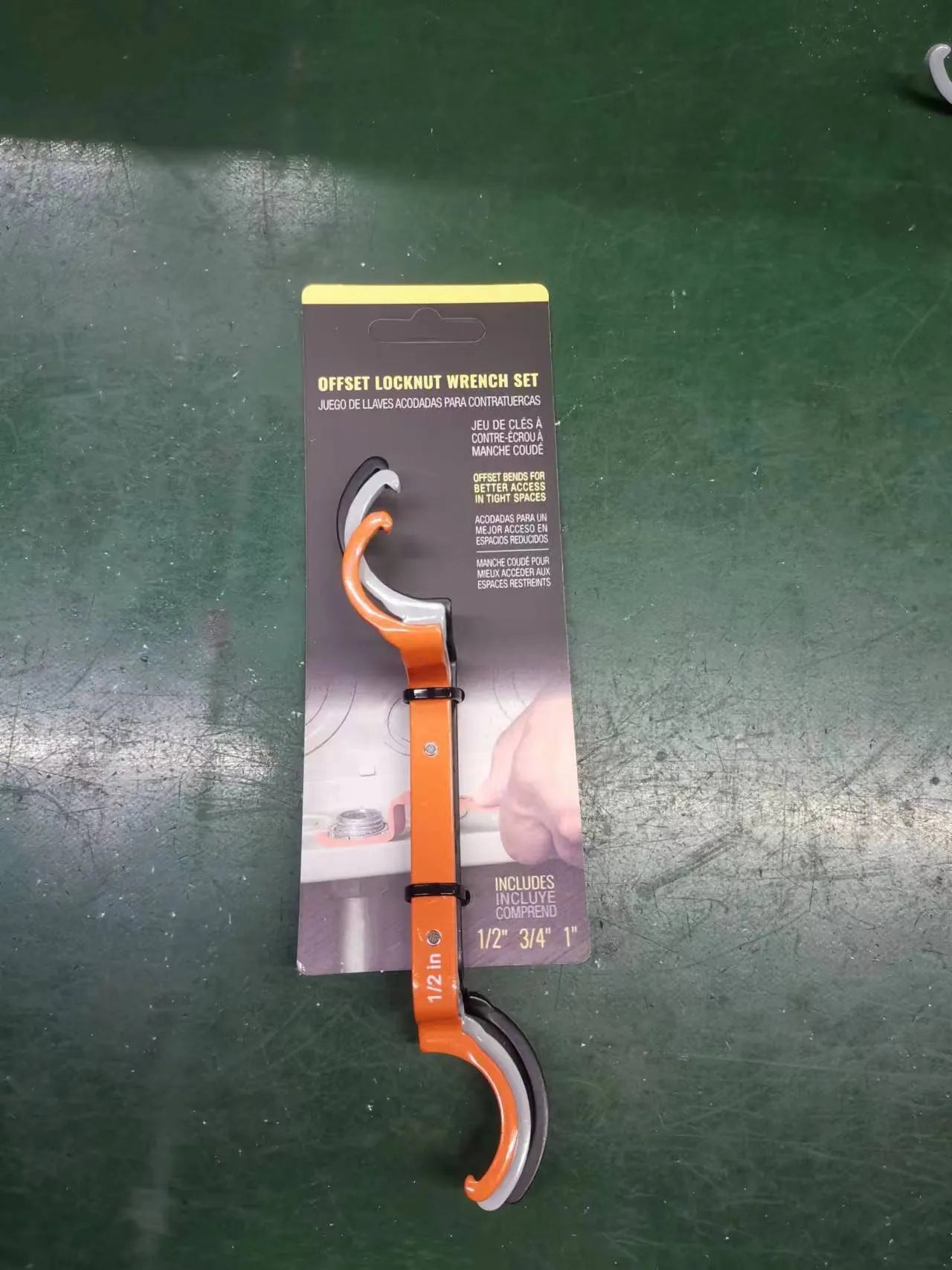 Three magnetic crescent wrenches with orange, grey and black handles showing suction and locking features