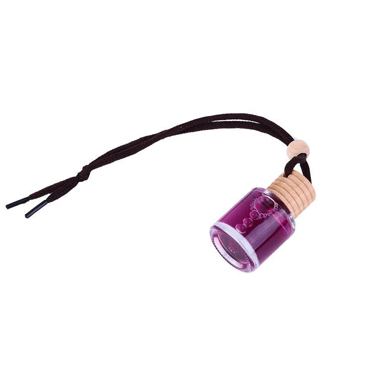 Glass bottle car air freshener hanging ornament showing six fragrance options: lavender, lemon, apple, strawberry, ocean, and floral