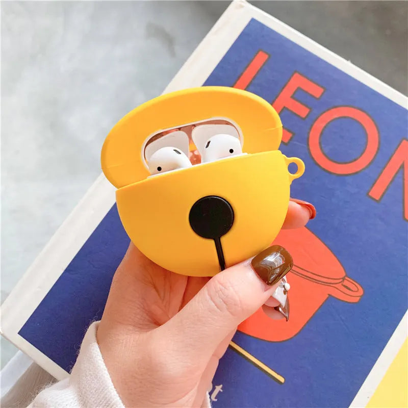 Yellow silicone protective case for AirPods 1 and 2 with a small bell charm attached.