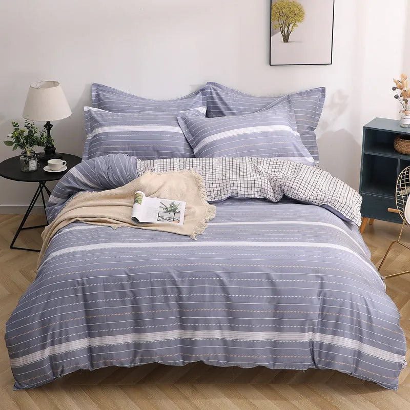 Cotton four-piece bedding set in multiple sizes with quilt cover, fitted sheet, and pillowcases