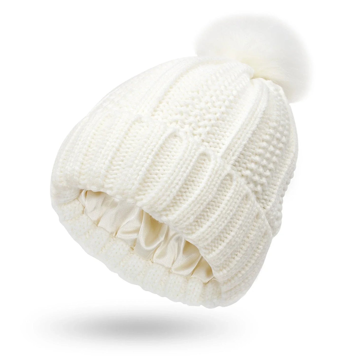 Cozy knit beanies with satin lining, paisley pattern, and faux fur pom poms in a variety of colors