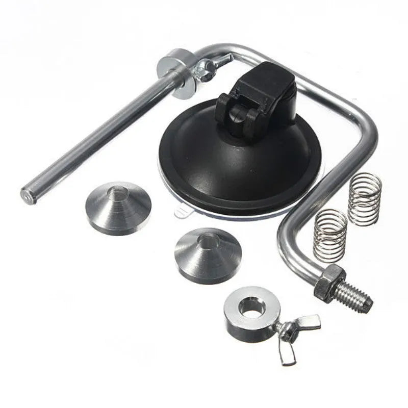 Silver aluminium fishing reel winder with adjustable tensioner and suction cup base on smooth surface