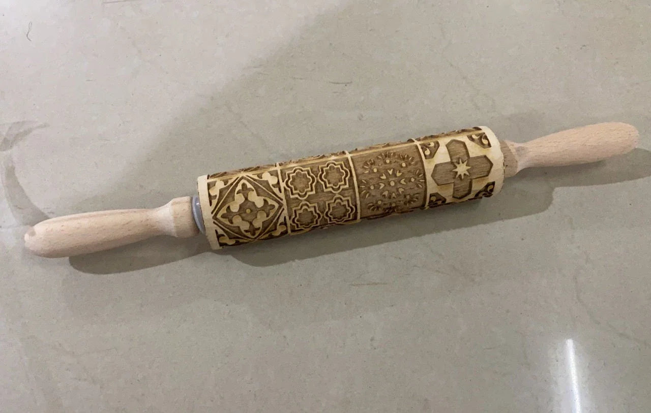 Personalized Christmas rolling pin with a variety of embossed holiday designs, including snowflakes, reindeer, and Merry Christmas patterns