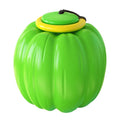 Green, orange, and yellow plastic pumpkin-shaped dog ball with squeaker for small dogs.