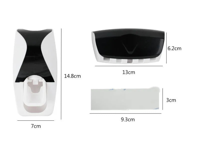 White bathroom accessories set with toothpaste dispenser and toothbrush holder mounted on smooth tile surface