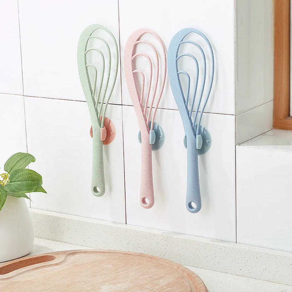 Flexible PVC suction cup rice scoop 19cm length blue colour mounted on kitchen tile