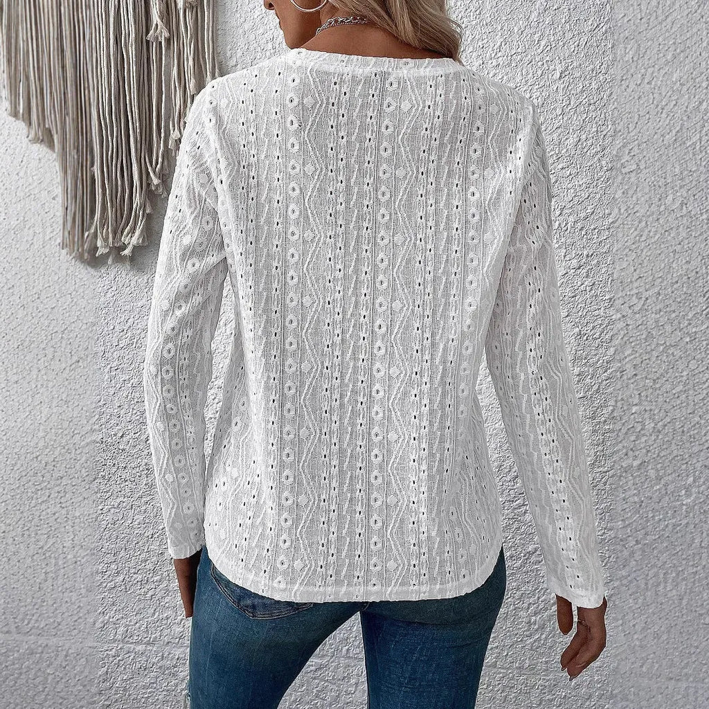 White hollow knit polyester T-shirt with round neck and long sleeves on hanger
