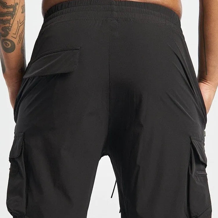 Men's black quick-dry sports shorts with elastic waistband for fitness and running.