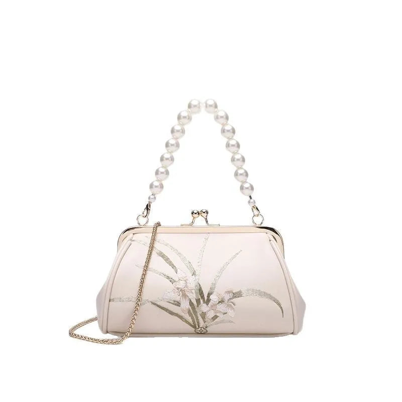 Beige embroidered women's shoulder bag with shell-shaped design in soft PU leather