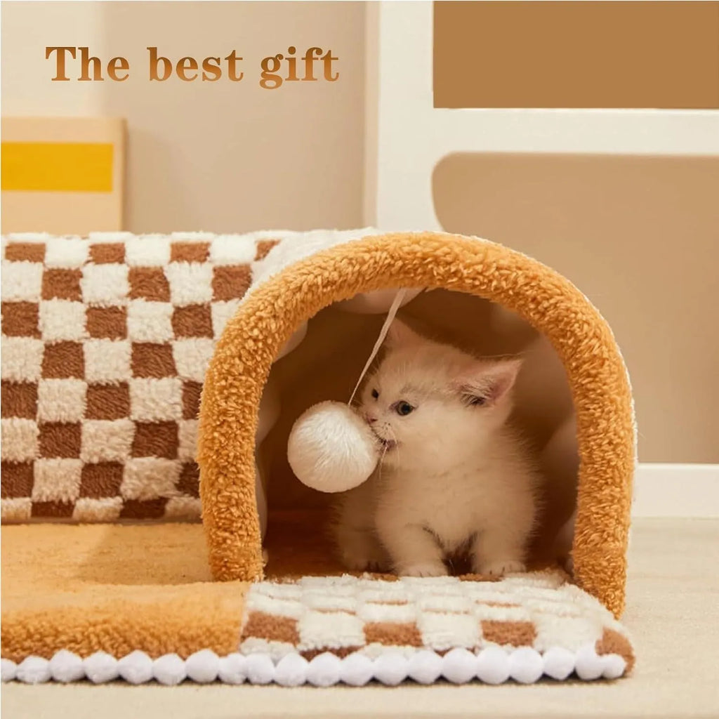Brown plaid collapsible cat tunnel bed with central mat on a wooden floor.