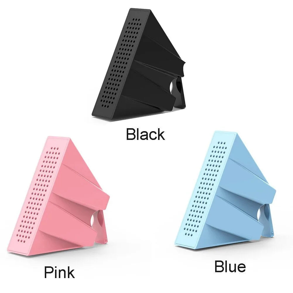 Mini black ABS plastic mobile phone amplifier bracket holding an iPhone on a desktop.