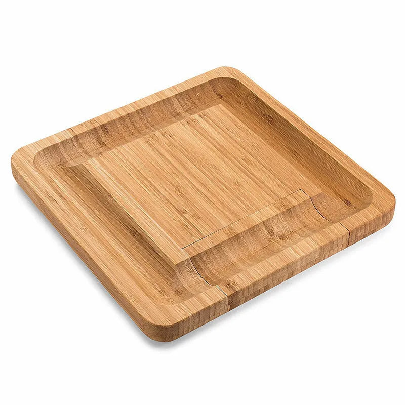 Square bamboo cutting board in wood colour with four knives and forks arranged on top