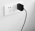 Black ZMI 65W USB-C notebook power adapter with compact design.